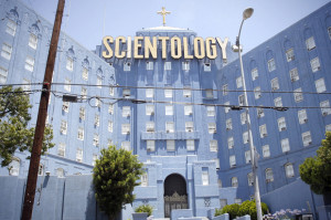 People walk past the Church of Scientology of Los Angeles building in Los Angeles